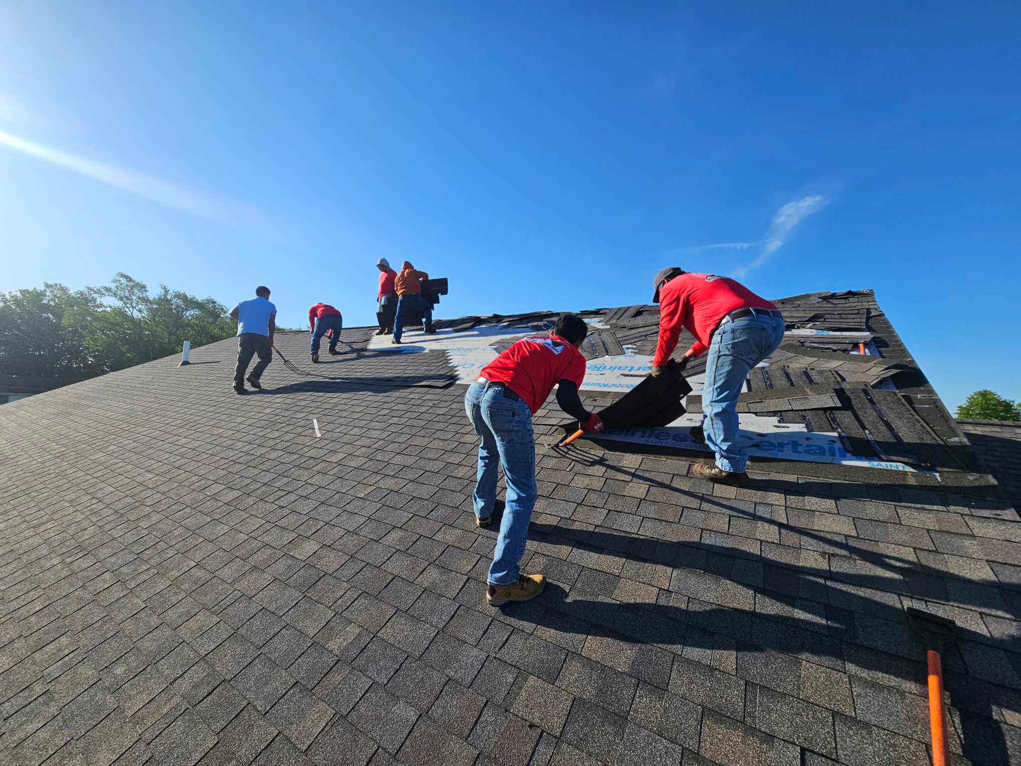 B&C Roofing crew tearing off old shingles Ottumwa